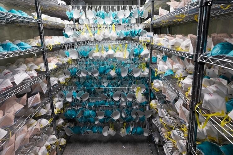 Racks of stacked disposable N95 masks awaiting distribution